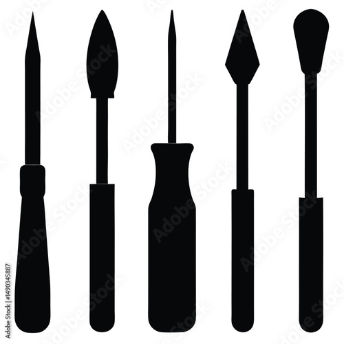 a set of various chisels with flat rounded and pointed tips
