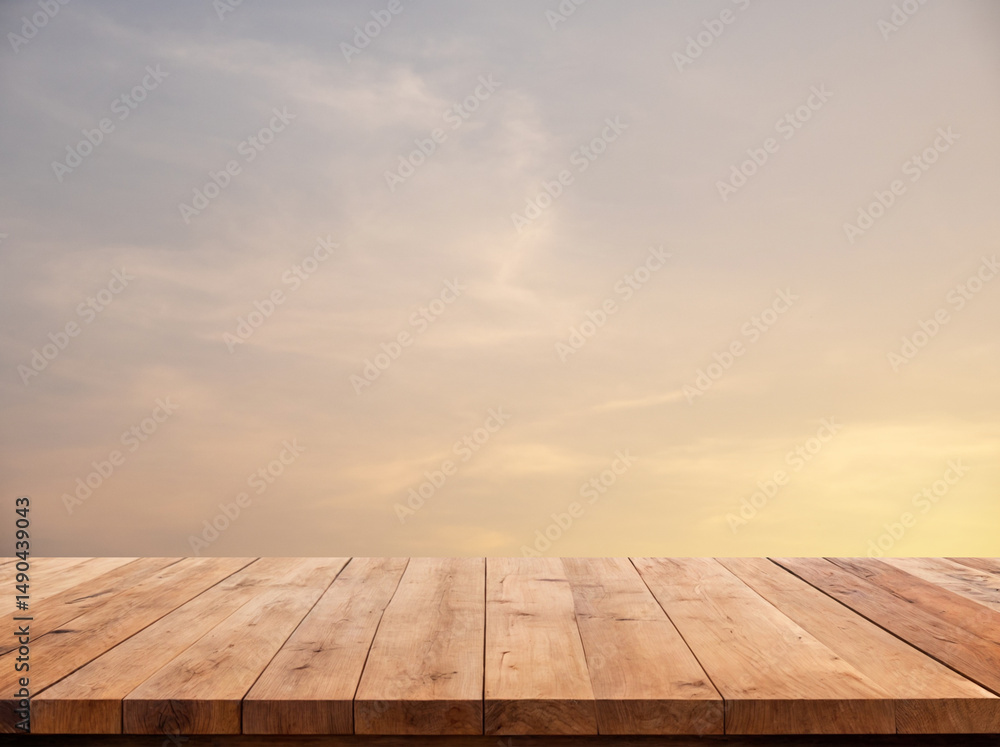 Wooden table surface with a scenic blue sky and fluffy clouds in the background, perfect for natural product displays or outdoor-themed designs. Wooden table surface with a scenic blue sky and fluffy clouds in the background, perfect for natural product displays or outdoor-themed designs.