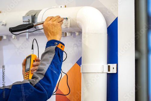 Technical diagnostics gas detector. Device for finding gas leaks. Technical diagnostics of pipes after installation. Gas company employee is looking for propane leak. Energy infrastructure security