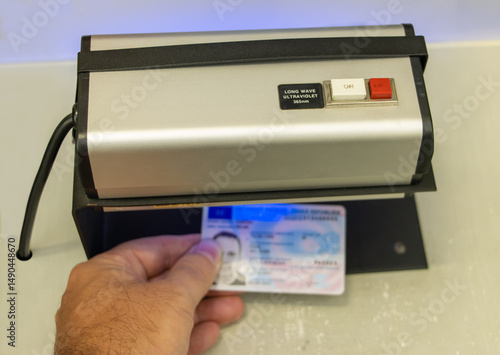 Verification of the validity of a personal identification document under ultraviolet light