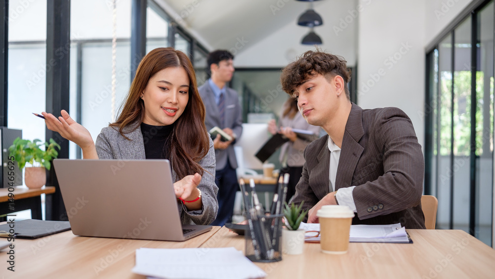 Professional team in active discussion, sharing ideas and business insights in a bright workspace. Professional team in active discussion, sharing ideas and business insights in a bright workspace.
