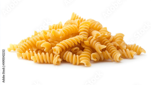 Pile of uncooked rotini pasta spirals isolated on a white background