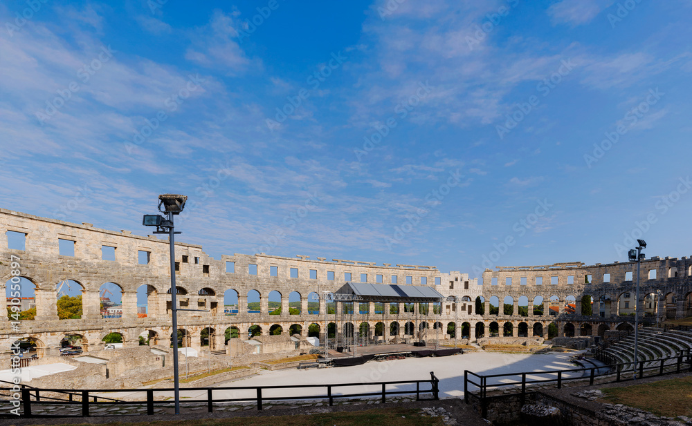 Fototapeta premium Ancient ruins of the Roman Amphitheatre, Istria peninsula. Pula, Croatia.