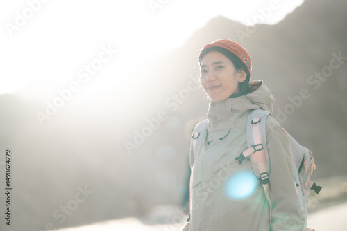 smiling Asian woman enjoys ...