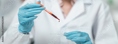 Scientist conducts a blood ...