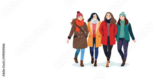 Four cheerful young women walking together in winter wearing stylish coats and hats
