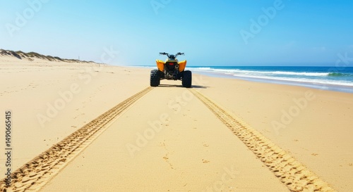 Yellow ATV on a sandy beach