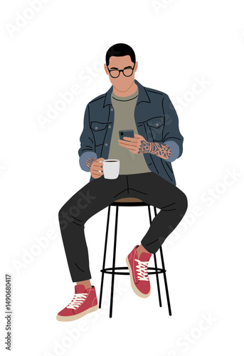 Trendy young man with tattoos, glasses, blue jacket, and red sneakers sitting on a stool with coffee and phone. Modern hipster style illustration. Isolated on transparent background