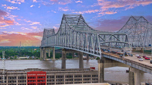 aerial shot of cars and truck driving on the Crescent City Connection bridge over the Mississippi River in New Orleans Louisiana USA