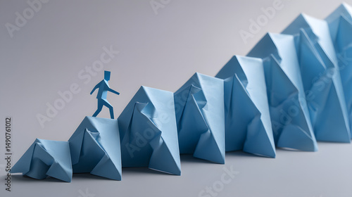 A blue paper figure climbs a staircase of folded blue paper, symbolizing growth and progress.