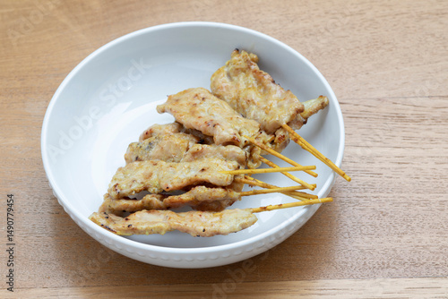 Pork satay on wooden background