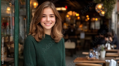 Wallpaper Mural Young woman smiles warmly at a cafe entrance on a bustling city street in autumn Torontodigital.ca