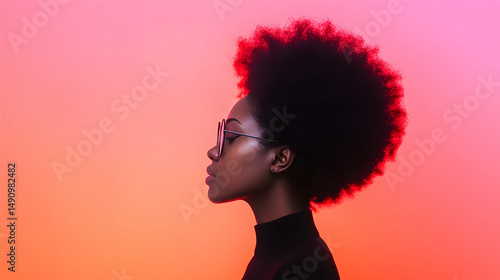 Profile of a Woman with an Afro Hairstyle Against a Red and Orange Gradient Background