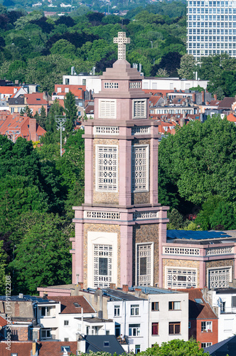Fototapeta The Sainte Suzanne catholic church and apartment blocks in Schaerbeek, Brussels