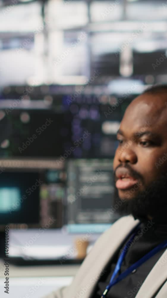Vertical video Lead data center admin overseeing IT expert integrating ...