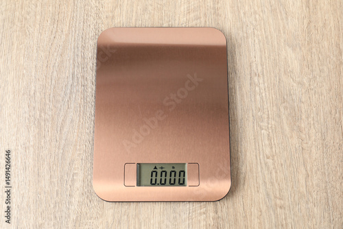 Wallpaper Mural Modern electronic kitchen scale on wooden table, top view Torontodigital.ca