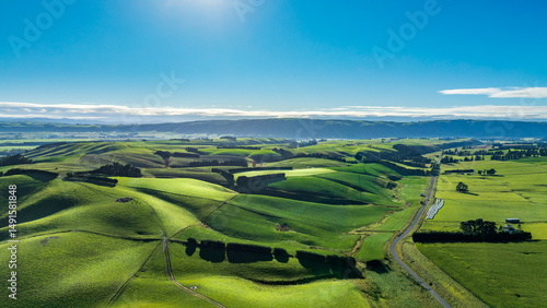 Rural country road winding its way through agriculture and farm land in the heartland of the South Island NZ