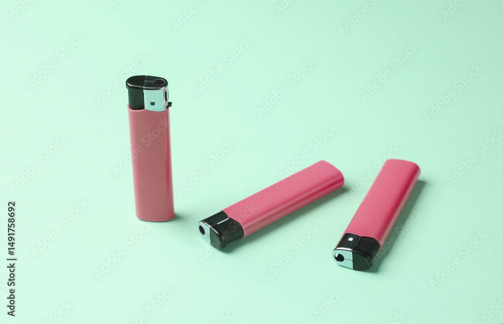 Lighters on pastel background. Minimalism.