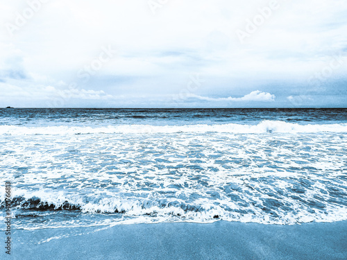 Blue ocean waves on the beach