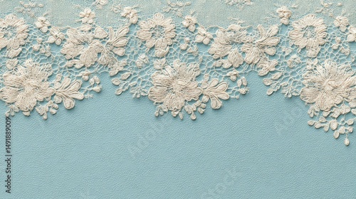 Delicate lace trim with floral embroidery on a light blue background