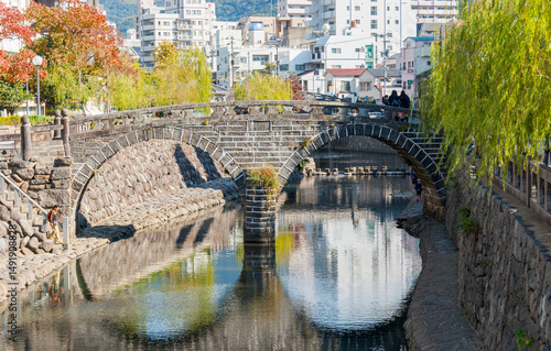Megane-bashi or 'Spectacles Bridge' in central Nagasaki, Japan.  The reflection of the double-arched bridge gives the impression of spectacles and is the oldest stone bridge in Japan