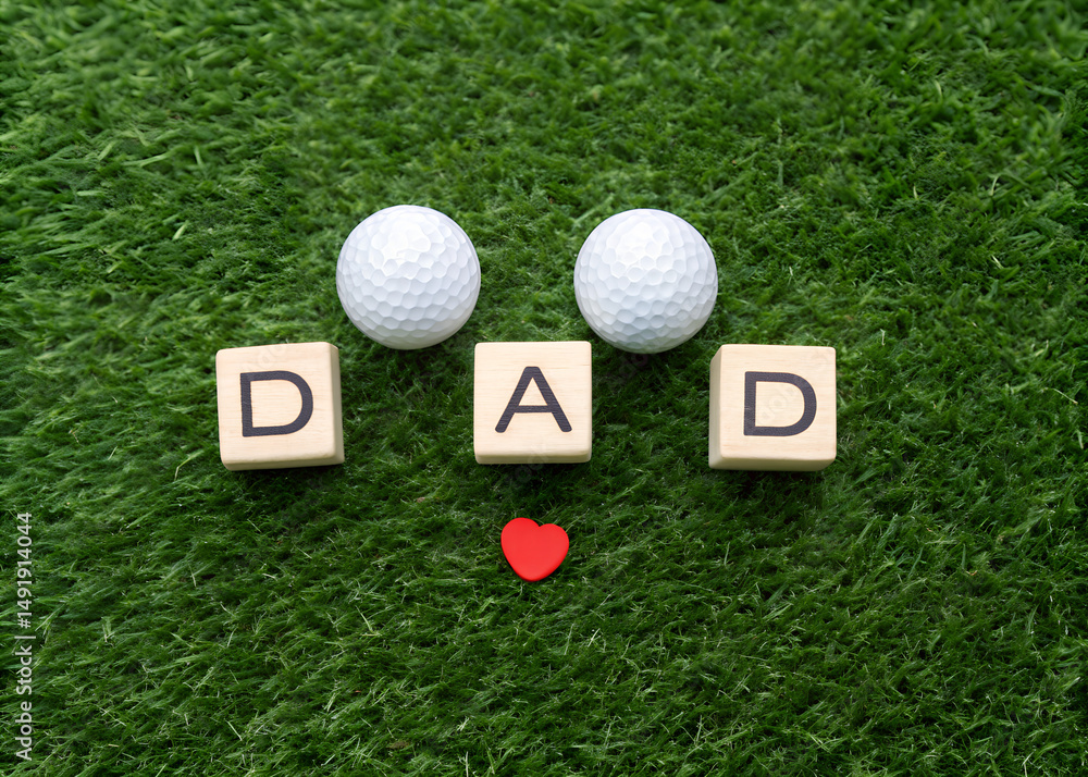 Naklejka premium Dad Golf Ball with Heart on Green Grass Display