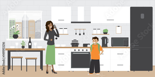 Hispanic mother and schoolboy in kitchen interior with various furniture and electronic gadgets. Brick wall on background. People talking on kitchen room, part of home