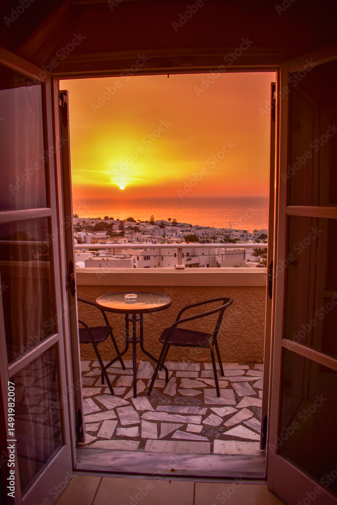 Fototapeta premium View of the sunrise from hotel balcony, Santorini, Greece