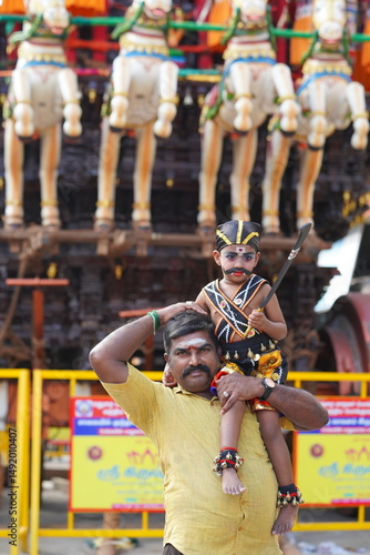 father and son. In India, a temple festival