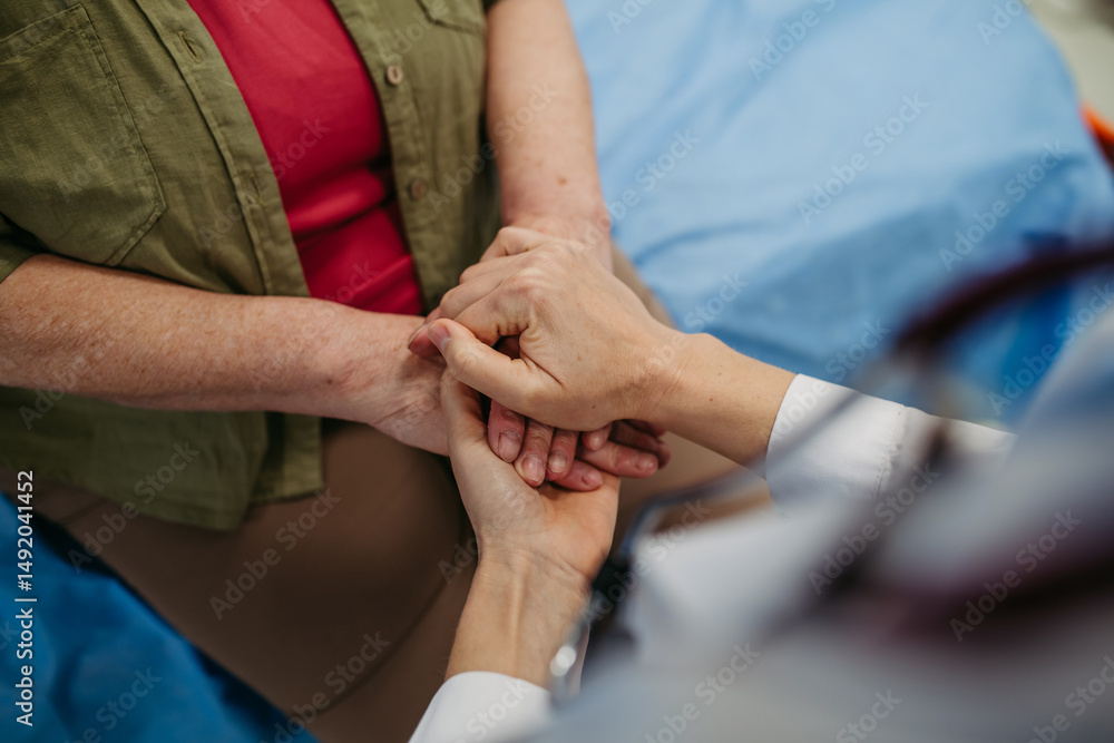 Doctor holding hands with senior patient in compassionate gesture. Doctor holding hands with senior patient in compassionate gesture.