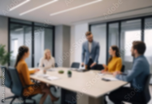 having a meeting in a blurry office, the atmosphere of a group of people having a meeting in a natural-themed, modern office with a wooden table, with a blurry office background