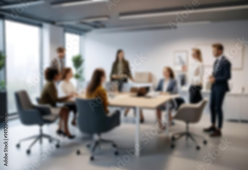having a meeting in a blurry office, the atmosphere of a group of people having a meeting in a natural-themed, modern office with a wooden table, with a blurry office background