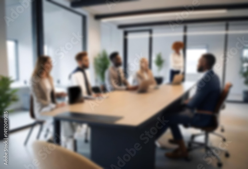 having a meeting in a blurry office, the atmosphere of a group of people having a meeting in a natural-themed, modern office with a wooden table, with a blurry office background