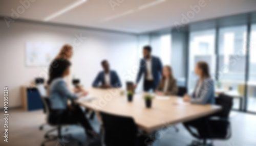having a meeting in a blurry office, the atmosphere of a group of people having a meeting in a natural-themed, modern office with a wooden table, with a blurry office background