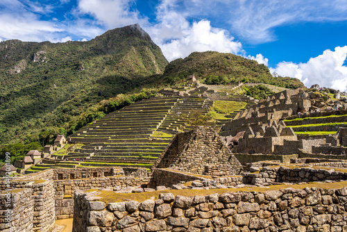 Panoramic view of Machu Picchu ruins with Huayna Picchu in background, Peru