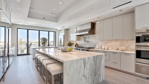 High-end kitchen with marble countertops, sleek cabinetry, and modern appliances for convenience.