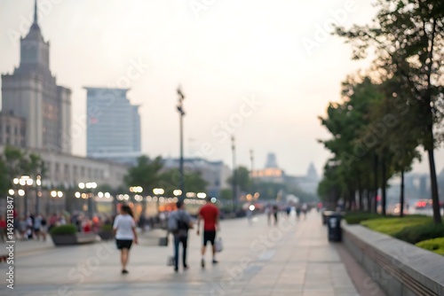 Blurry scene of a bustling urban promenade at dusk