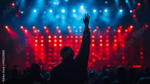 Wallpaper Mural Energetic concert crowd with raised hands in vibrant red and blue lights Torontodigital.ca