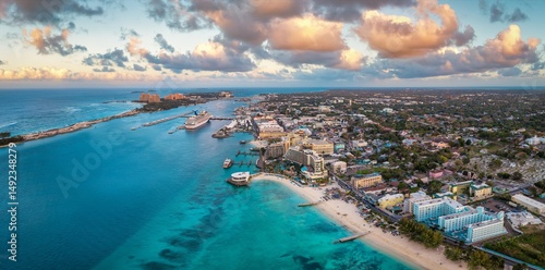 Fototapeta Naklejka Na Ścianę i Meble -  Aerial sunset view of Nassau town and harbour with Junkanoo beach at the Western Esplanade, New Providence, The Bahamas