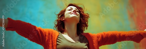 Happy Woman with Arms Open Against Abstract Backdrop is a professional-grade stock image suitable for editorial use, social storytelling, cultural representation, and marketing visuals.
