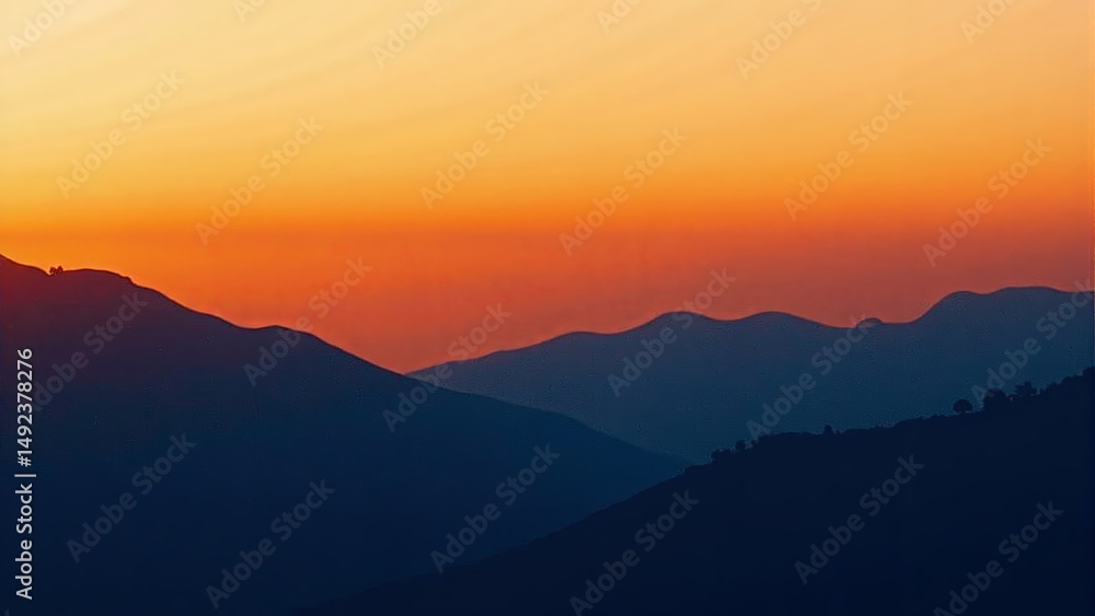 Mountain Range Silhouette Against Sunset Sky Mountain Range Silhouette Against Sunset Sky