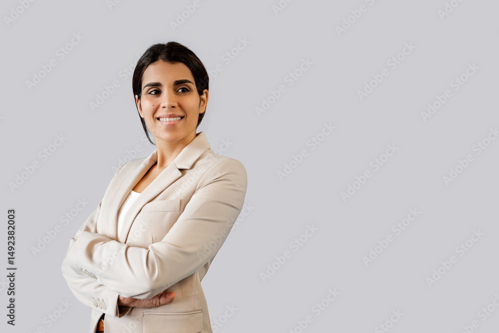 Happy smiling young latin or Indian woman realtor, hr or saleswoman manager in suit, looking aside at copy space. Portrait middle eastern businesswoman, business lady office worker standing isolated Happy smiling young latin or Indian woman realtor, hr or saleswoman manager in suit, looking aside at copy space. Portrait middle eastern businesswoman, business lady office worker standing isolated