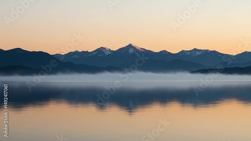 Wallpaper Mural Mist over calm lake with mountains during sunrise reflection   Torontodigital.ca