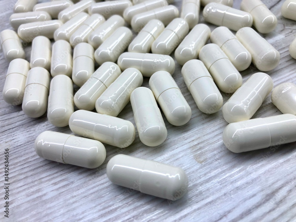 close up photo white capsules with medications or amino acids or creatine close up photo white capsules with medications or amino acids or creatine