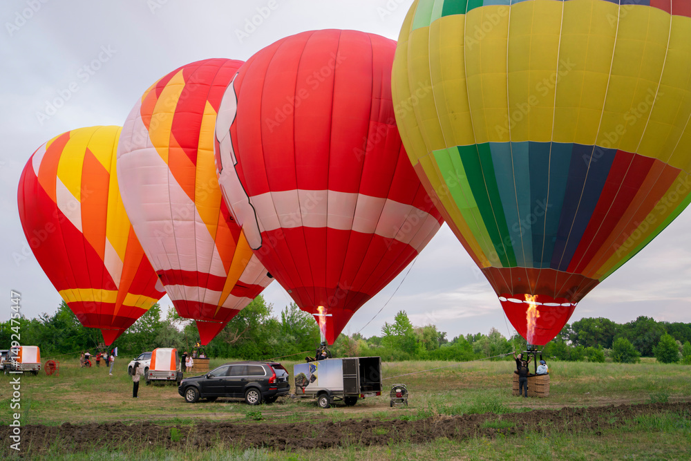 Obraz premium Aerostat balloons sit on the ground, ready for launch