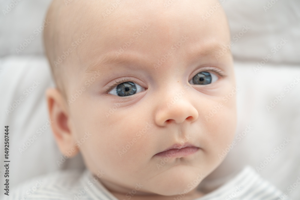 Sweet baby, calm in a neutral setting: A sweet baby gaze directly at the viewer. Capturing the purity of newborn infancy and innocence. Sweet baby, calm in a neutral setting: A sweet baby gaze directly at the viewer. Capturing the purity of newborn infancy and innocence.