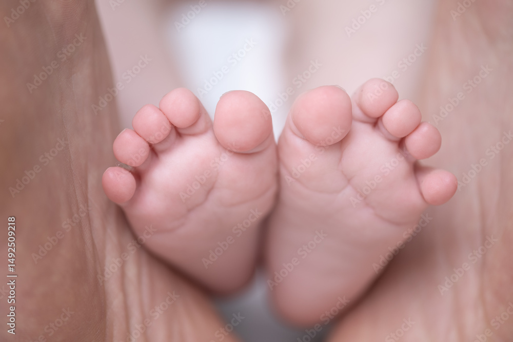 Tiny Toes: A close-up image reveals the delicate, soft feet of a newborn baby, a symbol of purity and new life. Capturing the innocence of early development. Tiny Toes: A close-up image reveals the delicate, soft feet of a newborn baby, a symbol of purity and new life. Capturing the innocence of early development.