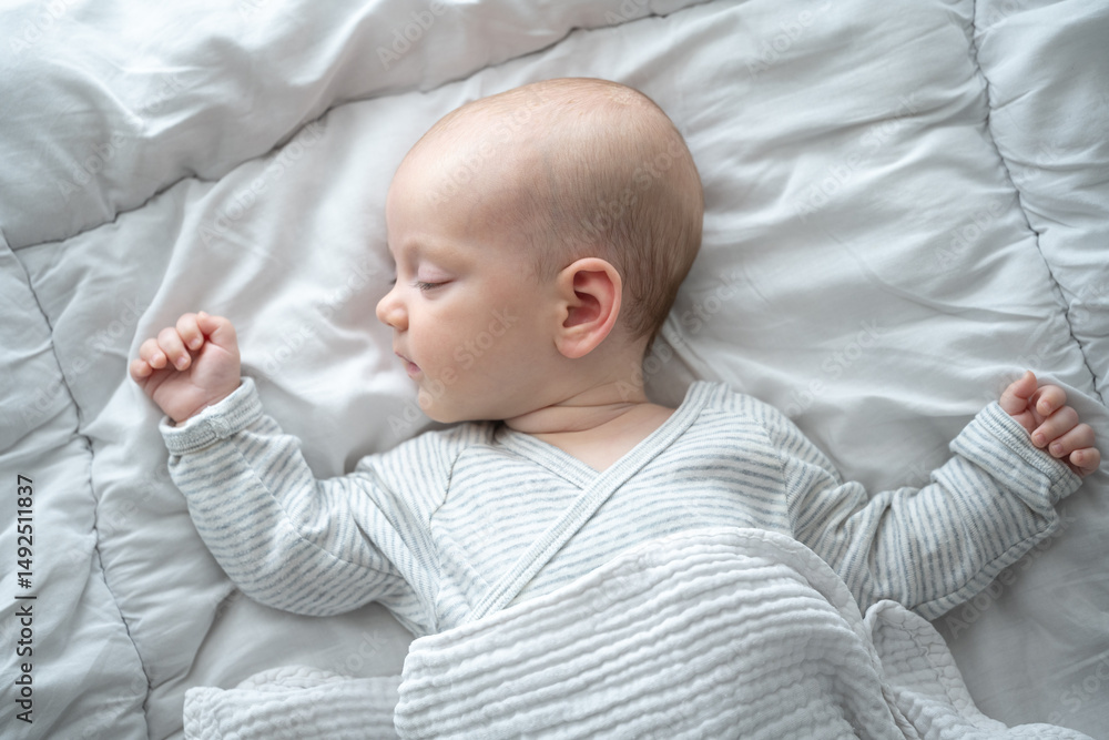 Sweet Dreams: A peaceful infant sleeps soundly, nestled gently within soft bedding, its serene face expressing innocence and tranquility. Sweet Dreams: A peaceful infant sleeps soundly, nestled gently within soft bedding, its serene face expressing innocence and tranquility.