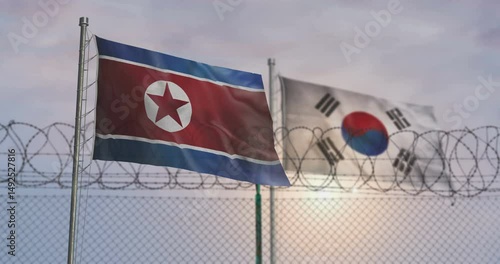 South Korea and North Korea waving flags on country border concept. Both Koreas blowing banner with barbed wire fence.