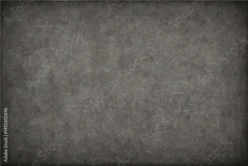 A dark gray grunge metal design on an old, rough concrete wall creates a textured backdrop